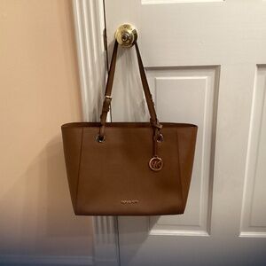 Michael Kors tote, tobacco brown 10” x 16” x 6”.  Gold trim and logo. Like new.